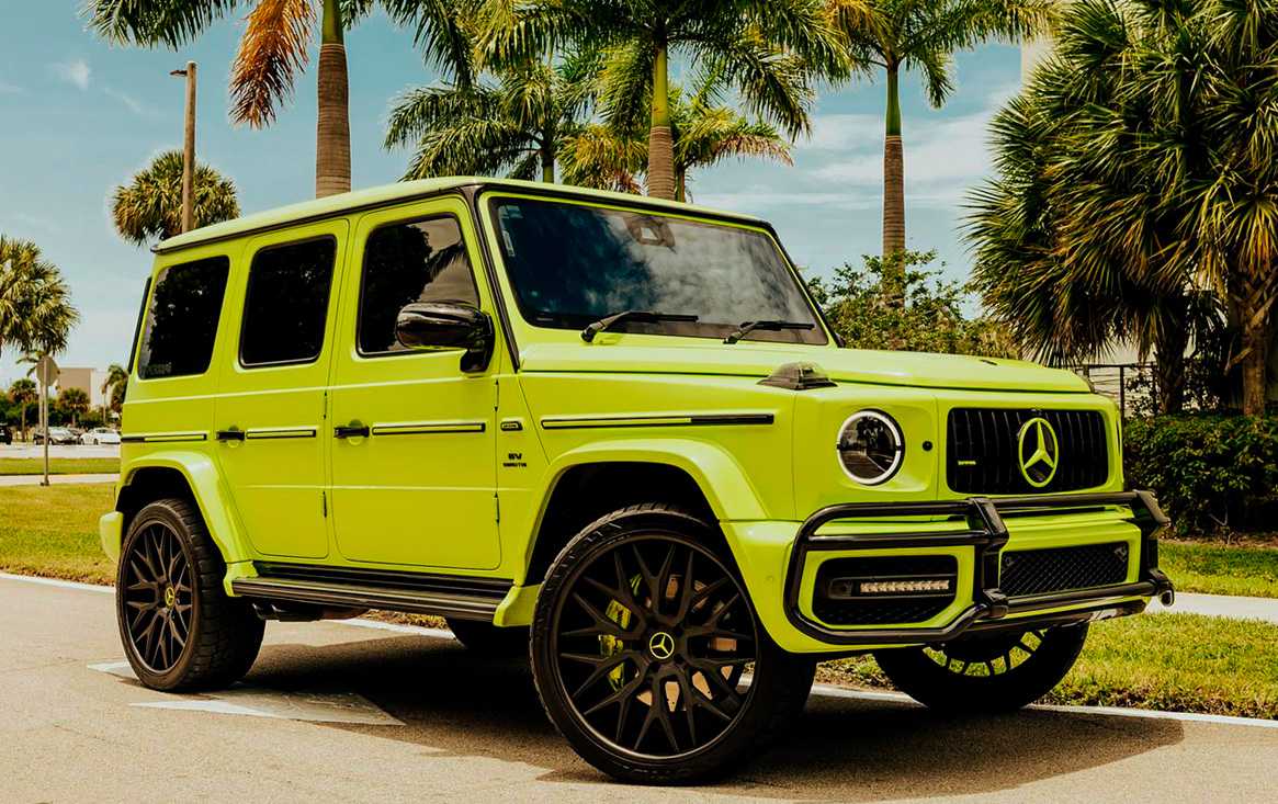 Lime Mercedes-AMG G63 beneath Miami palm trees